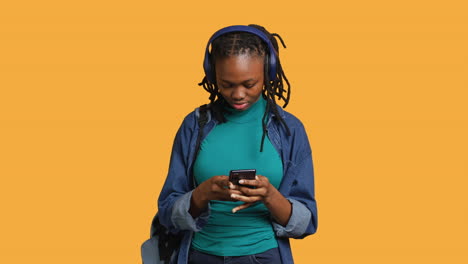 Woman-talks-with-friends-during-videocall-using-phone-and-headphones