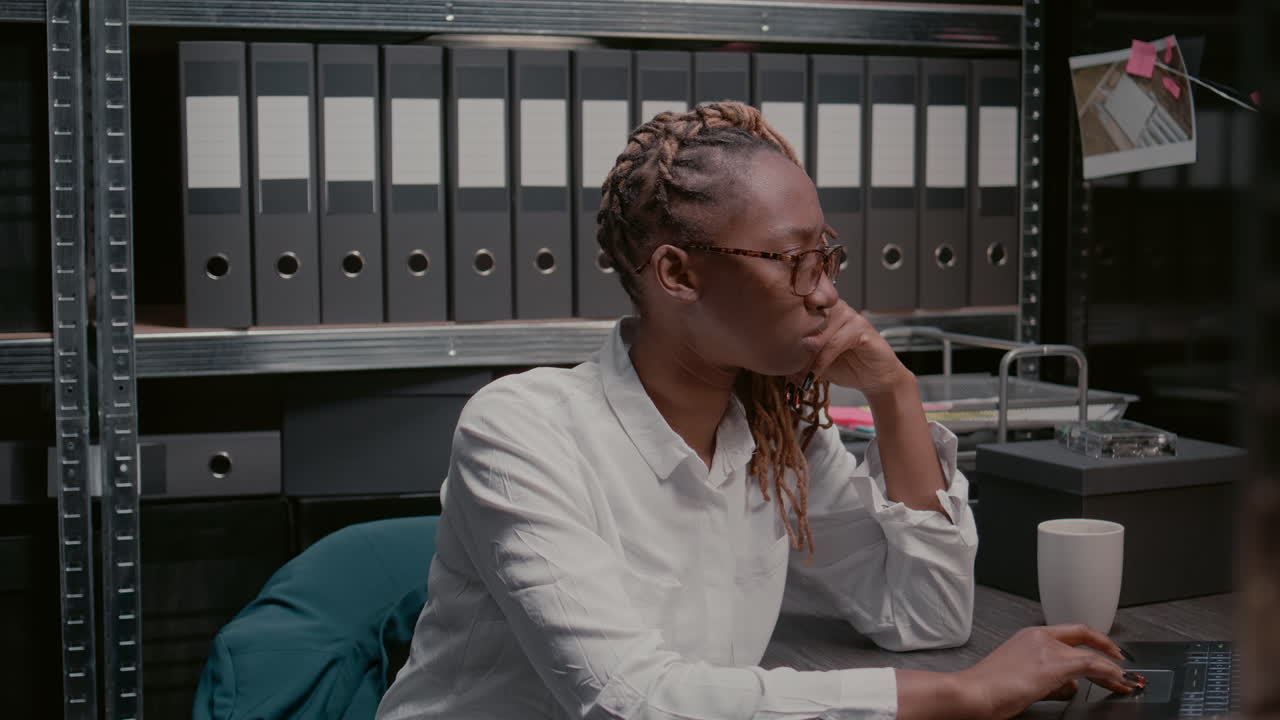 Woman in an office with files and folders