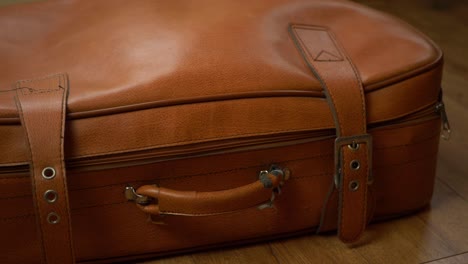 old brown vintage suitcase medium panning shot