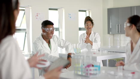 diverse students engage in a science class discussion, with copy space