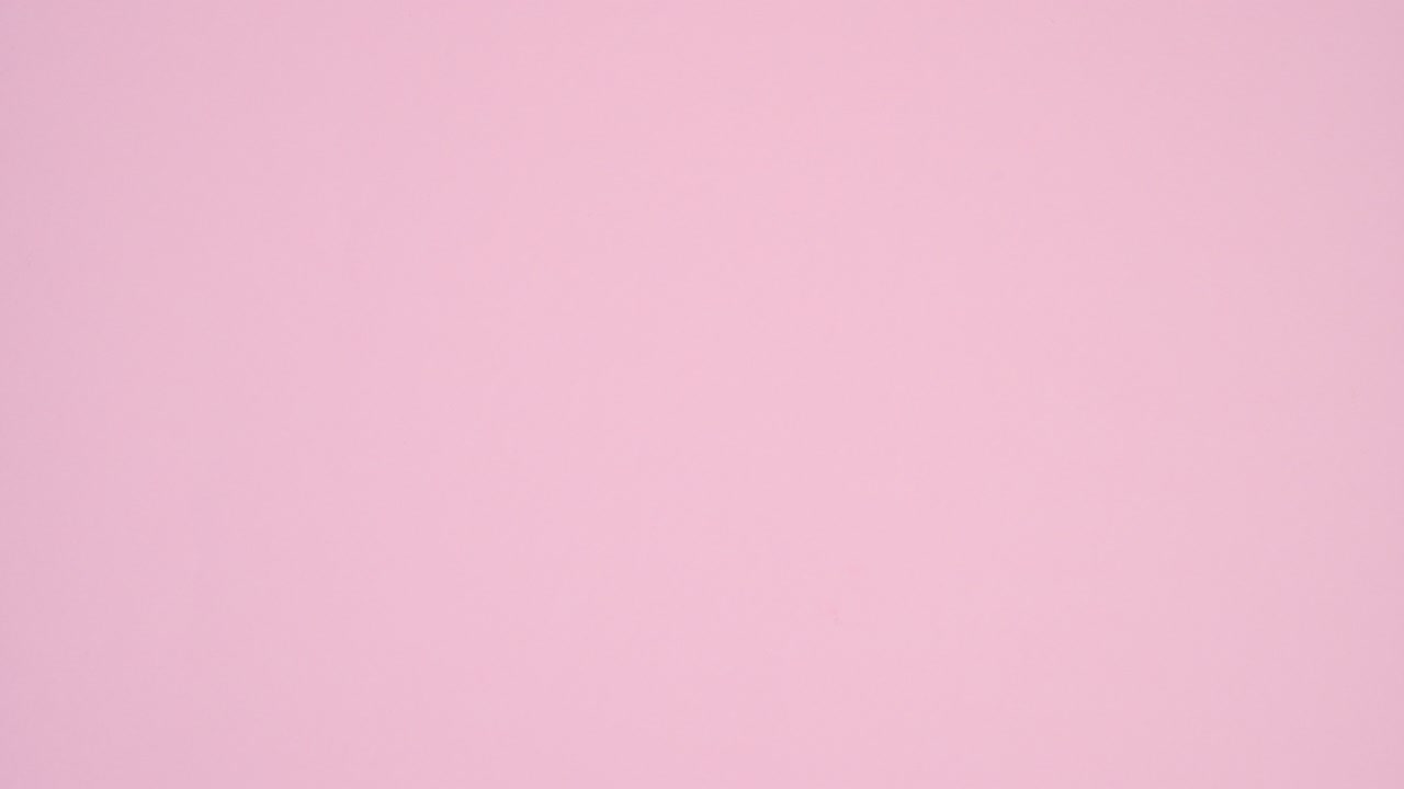 Coloring with paint brush pink heart balloon into red. Stop motion flat lay. Valentine's day