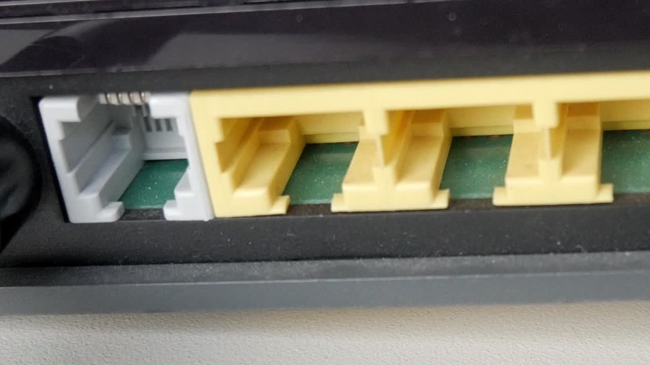 Close-up of a router's Ethernet ports, focused on connection concept