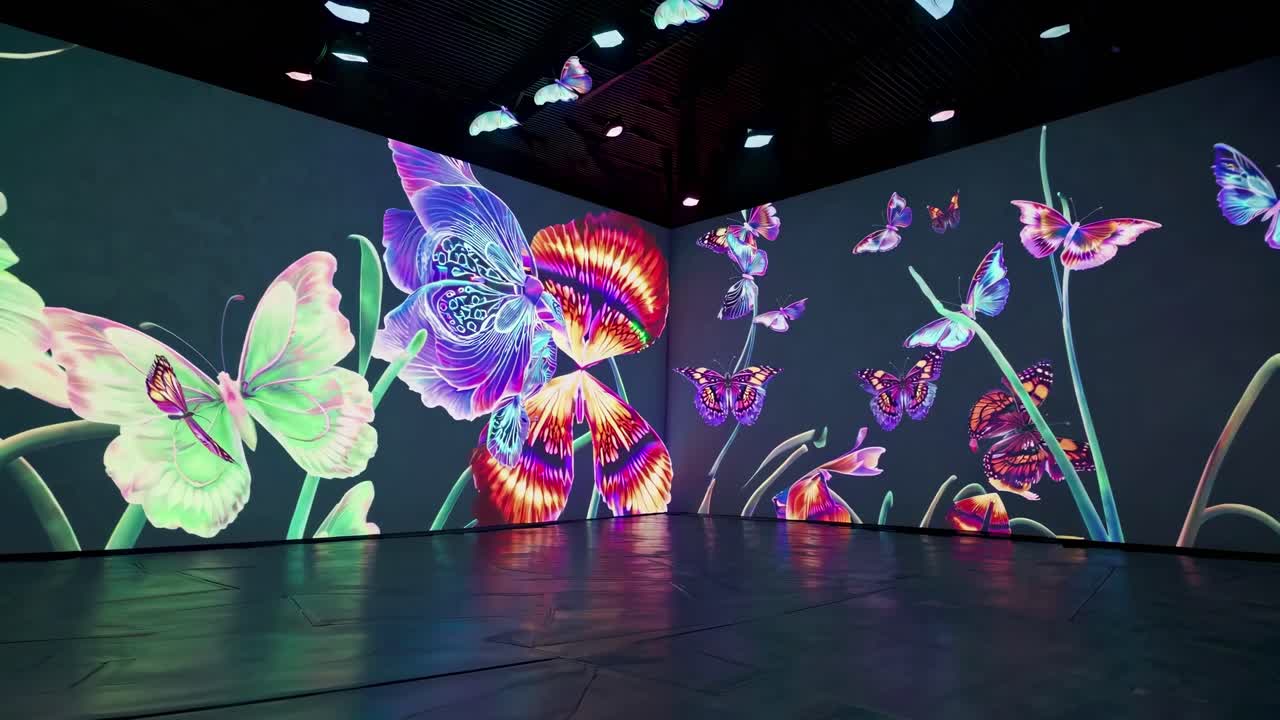 Immersive video art installation with vibrant, neon butterflies and flowers