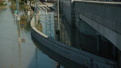 flooded underpass with submerged road signs and tram tracks in budapest, hungary, 2024