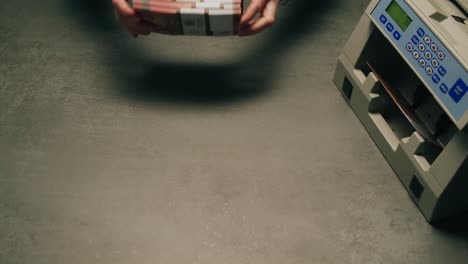 specialised police officer counting dollar banknotes in crime lab, conceptual image. high quality 4k footage