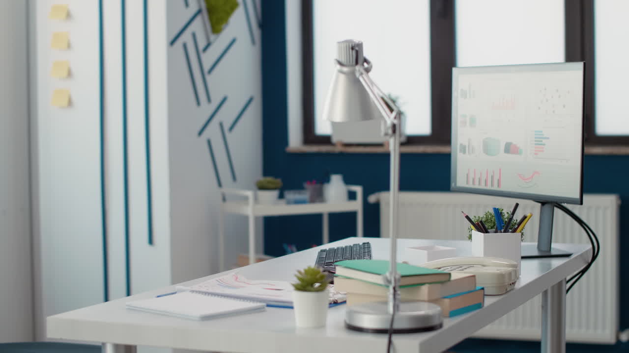 Nobody at office desk with supplies and marketing statistics