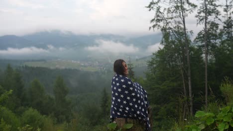 woman contemplating mountain view