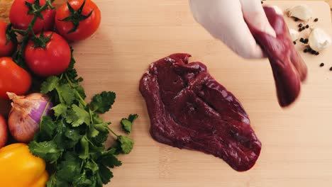 preparing raw liver with vegetables