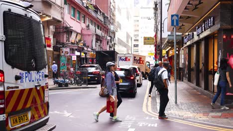 hong kong city street scene with police van