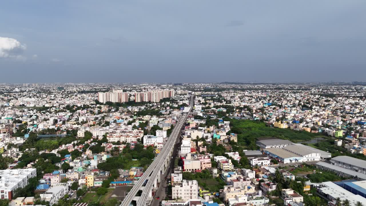 Iyyappanthangal Metro Growth: View shows dense residences and large apartments near the elevated Chennai Metro line (Orange Line), highlighting the area's development and solar adoption