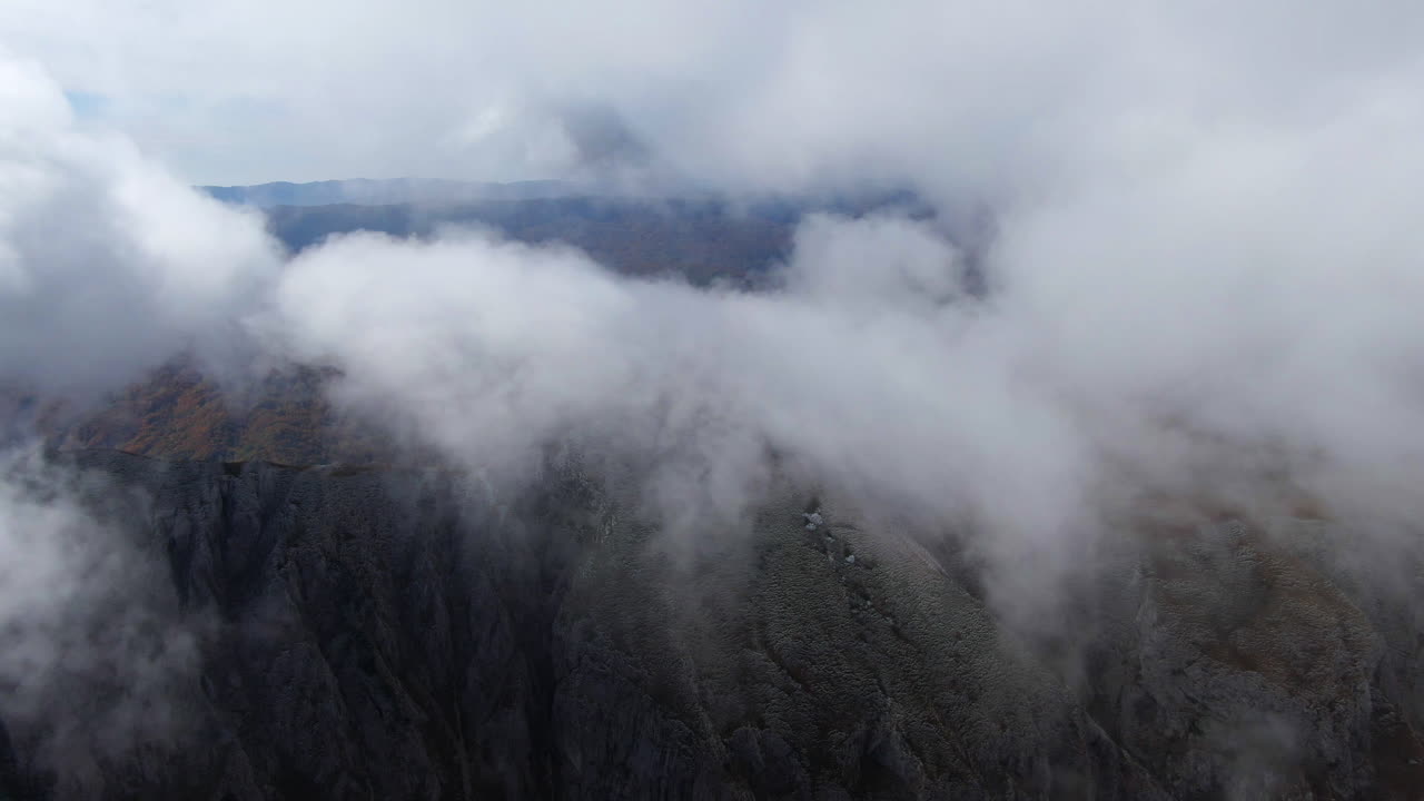 Misty Mountains: An Aerial View of Dramatic Peaks
