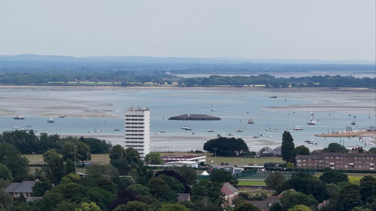 Southsea coast aerial view overlooking the Solent at low tide and Portsmouth high rise waterfront