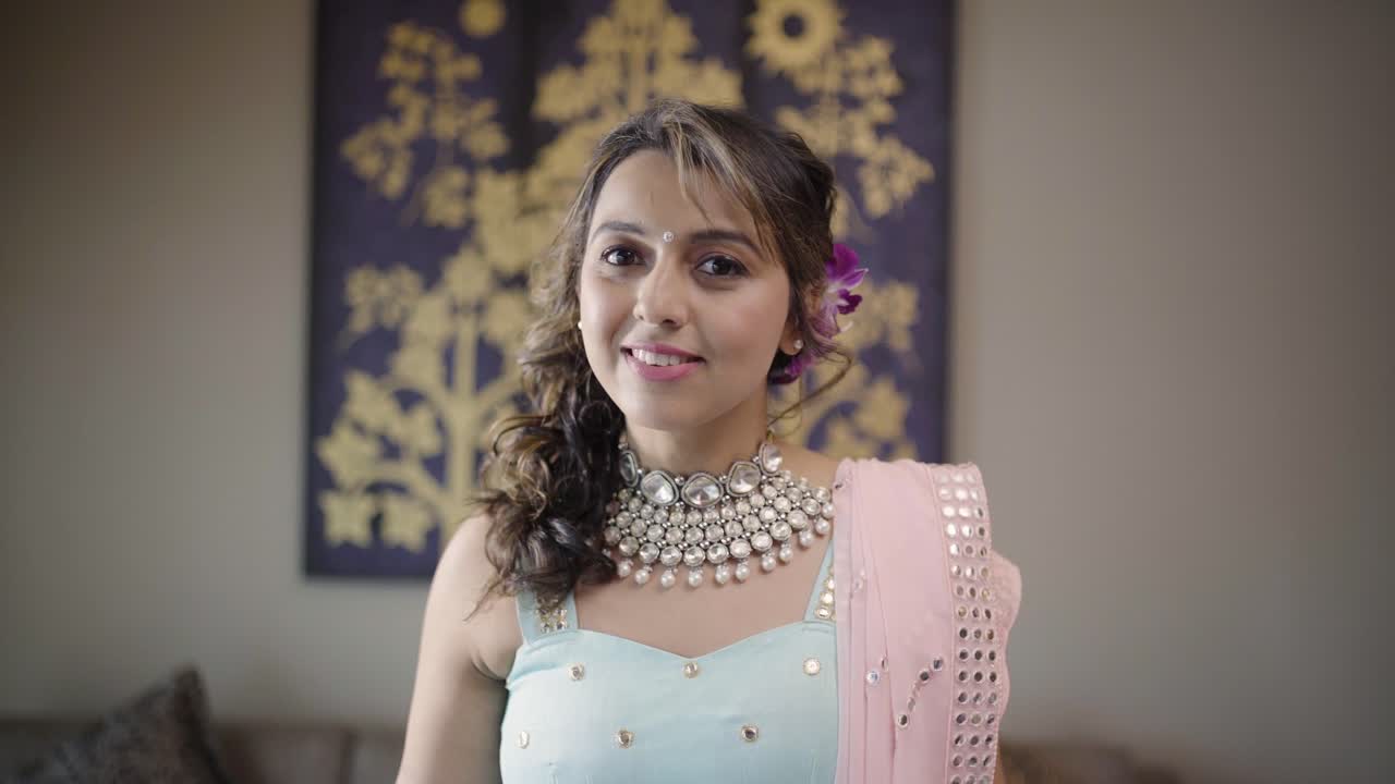 Lovely Indian Bride Smiling In Front Of The Camera At Mehndi Function For Her Wedding Week