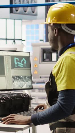 Vertical video Engineer overseeing solar panel production lines equipment using PC software