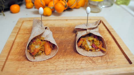 Beautiful-close-up-of-homemade-mexican-fajitas-made-with-whole-wheat-tortilla-on-wooden-board