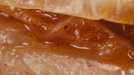 close-up of texture fermented spicy cabbage kimchi with in can. preservation of vegetables in glass jars. fermentation preserved kimchi cabbage with spices macro. asian cuisine.