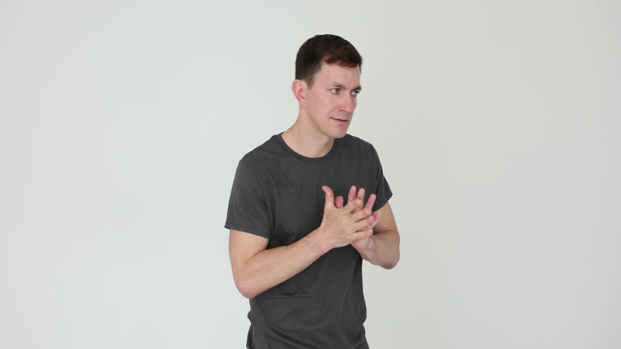 Man Rubbing Hands Together on White Background