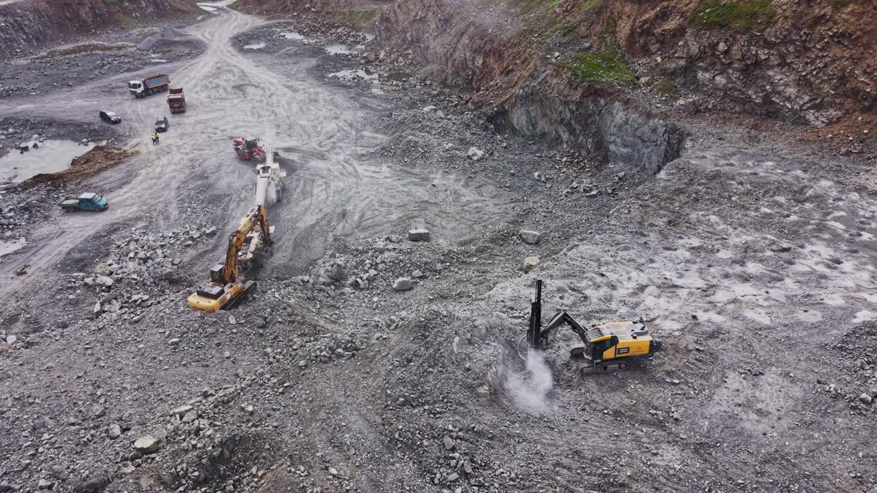 Aerial View of Heavy Machinery Working in a Large Stone Quarry
