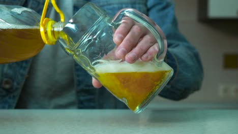 pouring beer into a mug