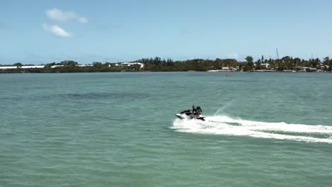 aerial video of jet-ski traveling through the florida keys