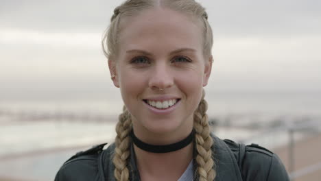 close up portrait of beautiful blonde woman smiling confident