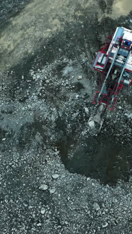 aerial view of heavy machinery at a quarry or mining site