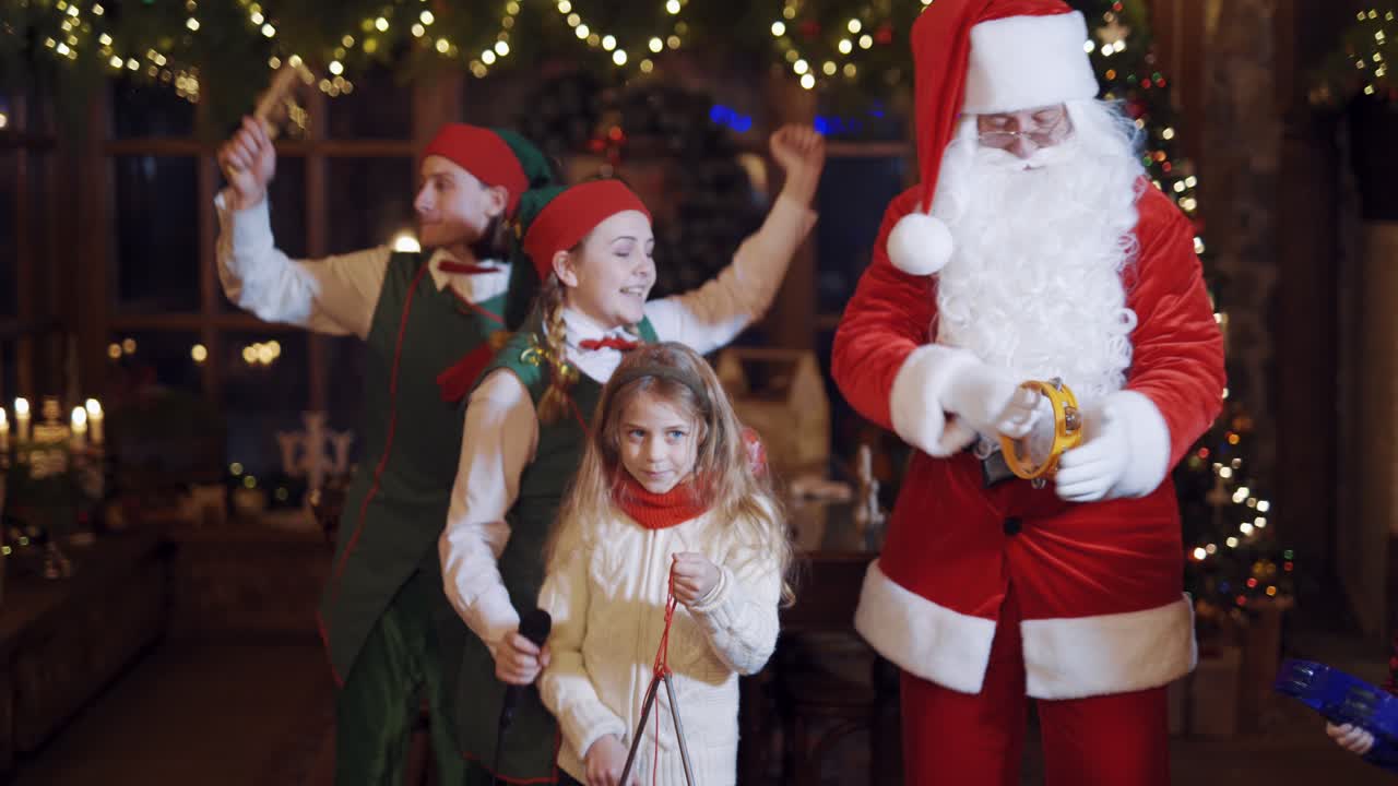 Having fun with children. Happy Santa Claus with children laughing and smiling