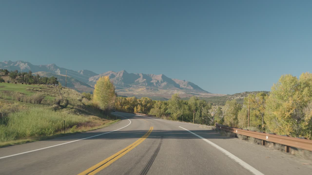 Scenic Road Trip Through Mountains in Autumn