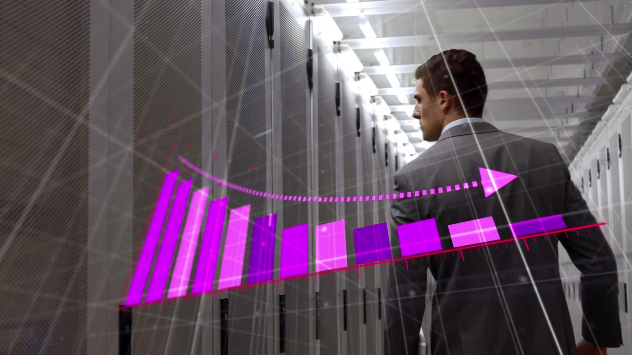 Animation of pink graph and data processing over businessman walking in computer server room