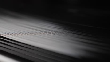 Close-up,-macro-shot-of-old-vinyl-disc-spinning-on-a-record-player