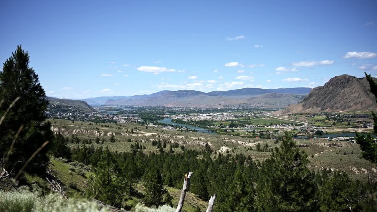Timelapse Glimpse of Kamloops' Majestic Thompson River and Cityscape on a Sunny Summer Day