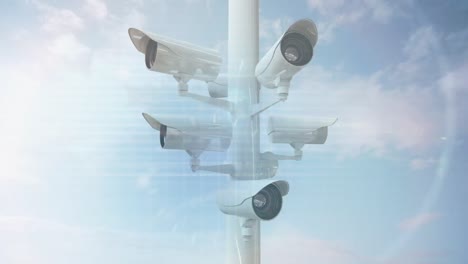 data processing over surveillance cameras against clouds in the blue sky