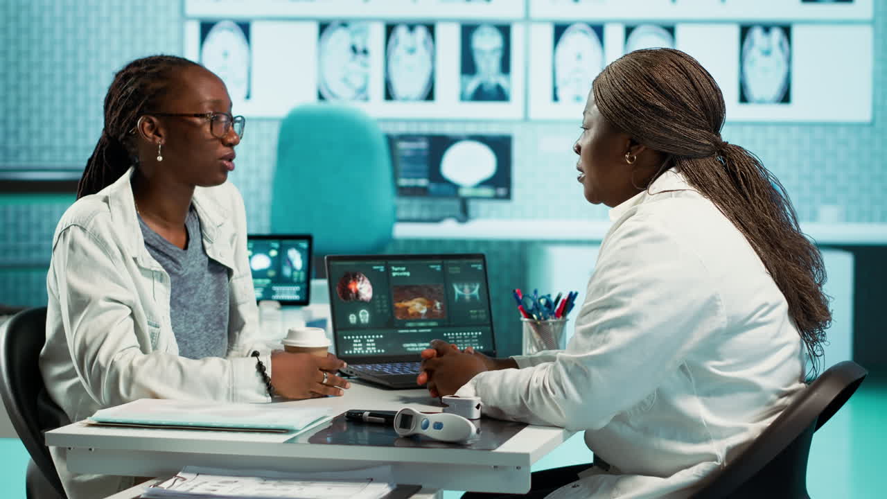 Medical consultation in progress with a specialist advising a patient