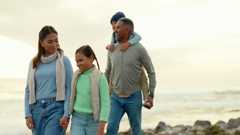 family is walking on beach