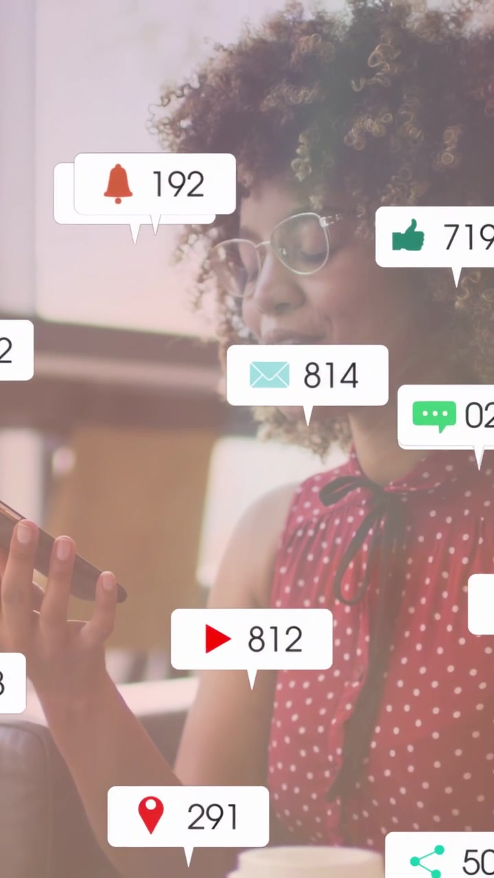 Vertical video: Woman holding phone making social bubbles cluster around phone then fade to engage