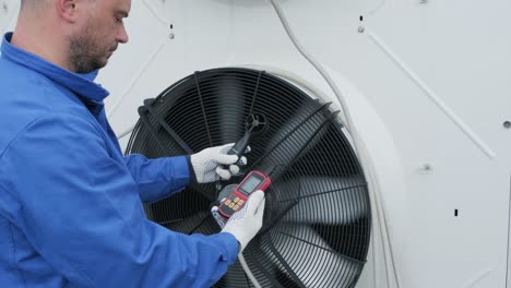 testing with an anemometer of an axial fan of the condensing unit