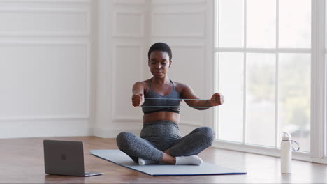 woman doing resistance band exercises at home