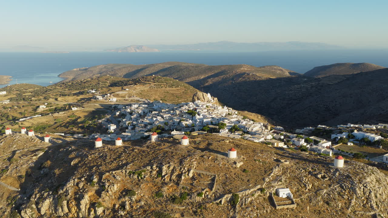 Historic Chora village in Amorgos island with windmills and white Cycladic houses, Greek Heritage travel