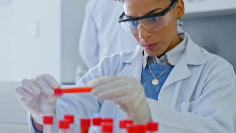 woman, scientist and vial sample for testing