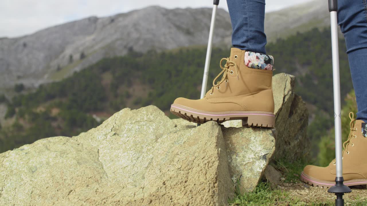 Person in hiking boots in the mountains