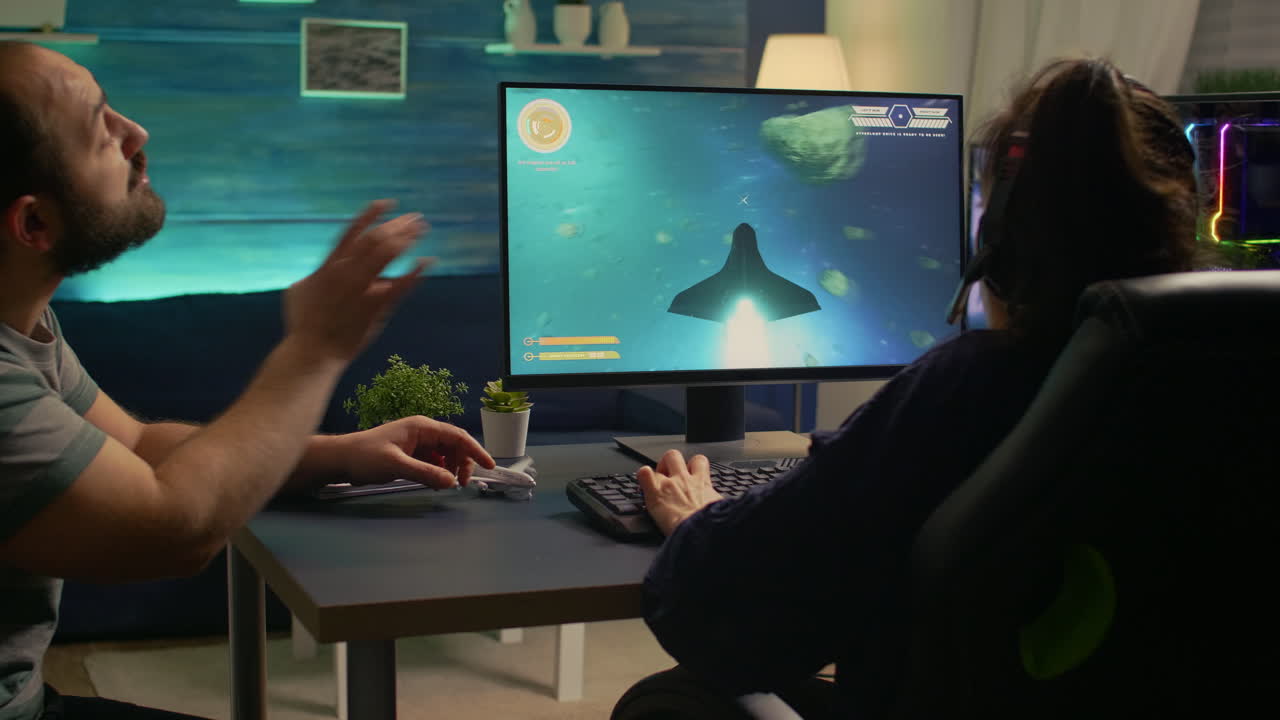 두 명의 게이머가 승자 제스처를 하고 있습니다.