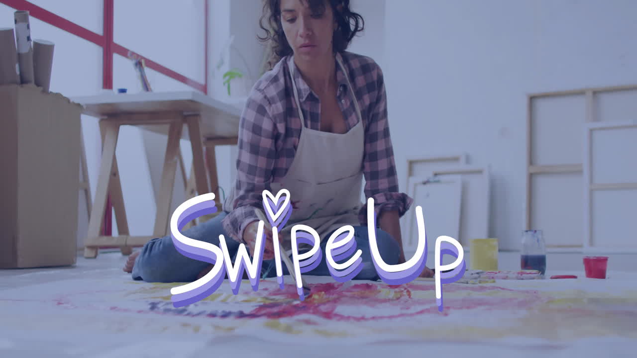 Artist painting on floor with Swipe Up text animation in foreground