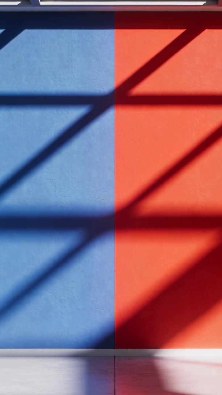 Vertical video: Shifting sun through skylight casting shadows sliding down two-tone wall at gallery