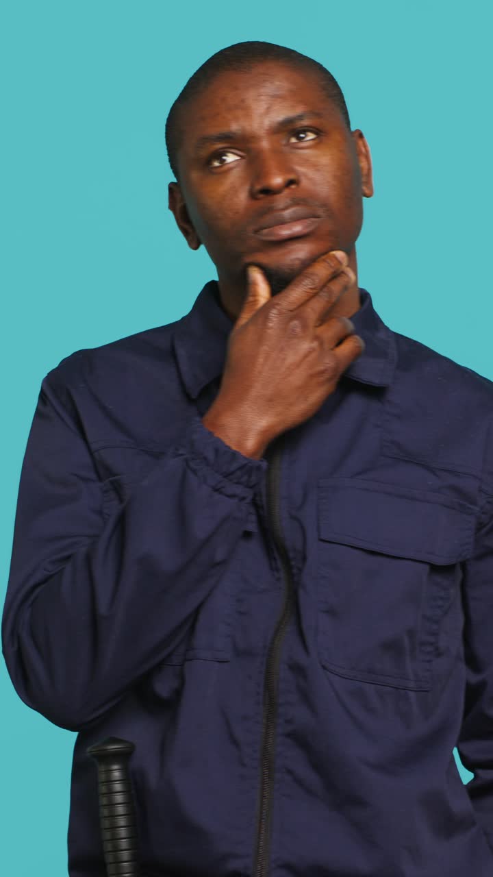 Thoughtful African American Man Pondering and Looking Around
