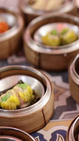 assorted dim sum dishes displayed on a table