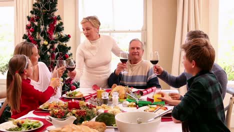 three generation family having christmas dinner together