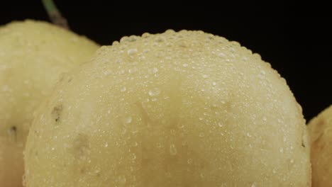 passion fruit closeup with droplets of water