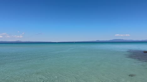 stunning beach scene in halkidiki, greece, with elegant sunbeds facing the crystal-clear turquoise sea. a perfect summer escape in the heart of the aegean.