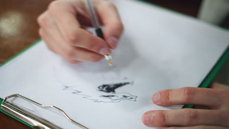 close view showing ink brush tracing inner mouth cavity and creating vivid paint effect on oral tissue surface under soft light capturing meticulous art process focusing on texture contrast