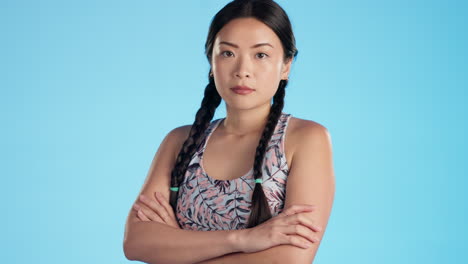 face, angry and asian woman with arms crossed